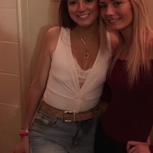 Plunging white v neck body suit